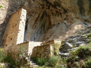 The Eremo di Soffiano with the partially reconstructed wall and high cave ceiling in the Sibillini Mountains, Le Marche, Italy